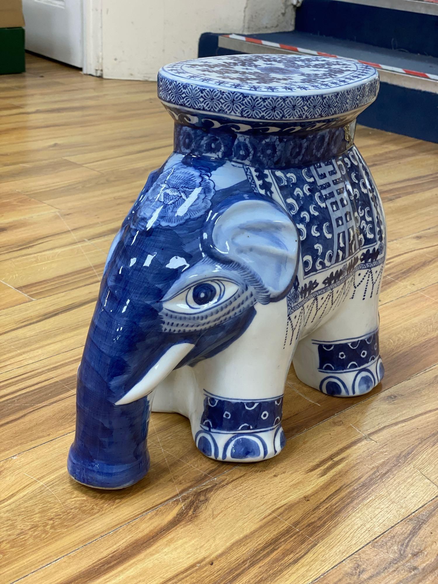 A Chinese blue and white ceramic garden seat and a similar elephant seat, 47.5cm tall